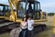 Katherine Rodriguez and Vincent Gomez of American Recycling in Tampa, Fla.,  test operate the Komatsu PC 200 HD. 
