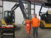Daniel Murphy of Murphy Logging inspects this John Deere 35G mini-excavator equipped with a NPK PH-2 hydraulic hammer.
