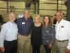 Pam Bucher (C), wife of the late Ralph Bucher, an employee of 30 years of Erb Equipment Company and manager of the Paducah, Ky., location receives a warm welcome to the open house from (L-R) Bob Erb, chairman, Randy Hoerman, new equipment sales manager, Carrie Roider, CEO, and Gregg Erb, president and director of sales, all of Erb Equipment Company.
