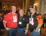 (L-R): Tim Keane, Joe Dombeck and Jayson Hutchinson, all of Ritchie Bros., dress in their favorite sports team gear for the OAIMA tailgate party. 
