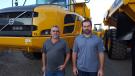 Dan Galusha (L) and Jamie Campagnone of Galusha & Sons, Queensberry, N.Y., look over this Volvo A40F articulated hauler.
