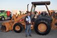 Gary Gray, Gray Trucking, Delaware Township, N.J., inspects this Case backhoe excavator before the start of the auction. 
