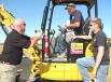 (L-R): Casey Clayton, Thompson Machinery CAT Rental Store representative, speaks with Matt Free and Dustin Murphree, both of Lackey’s Electrical, Tupelo, Miss., about the features of this Cat 304e2 CR. 
 