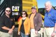 (L-R): Casey Clayton, Thompson Machinery; Brandy Settlemires and Buz Plaxico, both of Buz Plaxico Dozer Service, Corinth, Miss.; and Jim Simmons, Thompson Machinery, discuss some of the machines on display.
 