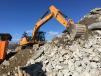 The Rockster impact crusher reduced the concrete and granite to the set size.