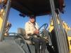 The auction featured many backhoe loaders. Jorge Arambula of El Paso’s Power Concrete checks out a Deere 310G.
