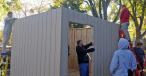 Students in the Ralston High School advanced woods and construction class assemble a shed that they constructed in class. The students framed and sided the side walls before delivering and assembling them on Nov. 3.