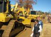 Registered bidders take one final look at the dozers that are lined up and ready to roll across the ramp.