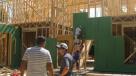 Jesse Johnson, (wearing hat), a student in construction management, at the Preston Hollow home job site.