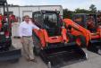 John Eighmy, general manager of the Florida Coast Equipment Naples, Fla., location, stands in front of this Kubota SVL 75-2 track loader.