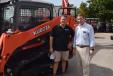 Tim Felts (L) of Blue Landscaping and Todd Bachman, president of Florida Coast Equipment, stand in front of this new Kubota track loader.