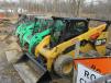 Equipment up for bid included this lineup of skid steers. 