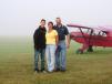 The Hiltz family waits for fog to lift to fly during a commercial shoot for his bank.   