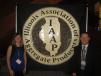 Jodi Perez (L), IAAP office manager, and Randi Wille of LaFargeHolcim welcome the attendees to the annual convention.  