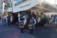 This mini pipe band performed for guests in front of this Terex Trucks TR60 rigid hauler. 
