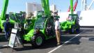 Travis Morrow (R) of GSE&E speaks with Tom Brlyeat of Tom’s Tree Removal about the Merlo telehandlers.
