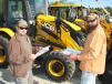 Timothy Moore (L), Moore’s Road & Land Maintenance, Ridgeland, S.C., and Brock Burnett, Burnette Construction Services, Ridgeland, S.C., compare notes about some of the new JCB backhoe loaders about to go on the auction block. 