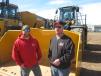 Nate Bleskacek (L) and Doug Johnson, both of A-1 Excavating, check out the bucket of this John Deere 844K wheel loader. 