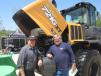 Ken Joniak (L) and Bill Schneider, both of Windy City Truck Repair, look at the engine of this Case 721G XT wheel loader. 