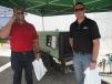 Phil Terhaar (L) and Brian Connolly, both of Superior Construction, take a look at this Sullair 185 air compressor. 