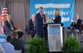 Mandy Brawley, Deputy Director of Global Business for the South Carolina Department of Commerce, presents Atlas Copco AB President and CEO Mats Rahmstrom with a gift during the speeches portion of the grand opening of the Atlas Copco production facility in Rock Hill, South Carolina, Wednesday, May 17, 2017.
