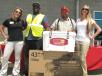 Yancey’s Amanda Hague (L) and Kristina Speach (R) present the grand prizes of the day. Antonio Dubose (second from L) of McShane Construction, Mobile, Ala., won a 43-in. flat screen TV, and Alan Cawthon (second from R) of Alan Cawthon Grading, Jackson, Ga., won the Yancey-Yeti cooler.  