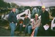 Three generations of the Marion family sit on an excavator as auctioneers called the auction of more than 1,100 individual lots. The owners of Marion Excavating of South Hadley, Mass., include Todd, his uncle, Russ, and sons, Mark and Reed Marion. Marion Excavating has been in operation for 45 years. 