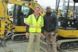 Nick McPeak (L), equipment specialist of Ransome CAT, and John Haye, owner of Haye Construction, Philadelphia, Pa., talk about the features of the Caterpillar 303.5 mini-excavator.