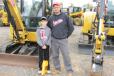 Charles Hartman of Hartman Land Care, Lehighton, Pa., and his son, Zander, are thinking about adding a Cat mini-excavator to their fleet.
