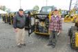 Bill Kelly (L), product support sales representative of Ransome CAT, and Tom Caracio of WGP Inc., Wind Gap, Pa., check out the engine of a Caterpillar 236D skid steer.
