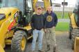 Noah (L) and Travis Newcomb, both of Cornell Construction, Woodbury, N.J., may be interested in purchasing a Caterpillar 420F wheel loader.