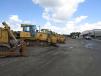 A line of dozers were ready to go on the block.