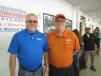 Jay Germann (L), used equipment manager, Roland Machinery Co., and Roger Martinez, Ritchie Bros. 
