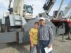 The father and son team of Kip (L) and Ryan Hoerr, both of Hoerr Machinery LLC, inspect this Terex RT 665 crane. 
