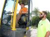 Josh (L) and Joel Passons, both of Passons Construction, Sparta, Tenn.,  test operate a Volvo ECR88 mini-excavator.
