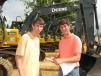 Neal (L) and Ben Lassiter of Dubose Construction, Mount Meigs, Ala., show interest in some of the late-model John Deere machines. 