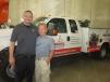 Ben Sanders (L), branch manager of Deutz Service Center, St. Louis,  shows his dad, Randy, the new facility. 