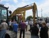 Auction attendees gather to bid on a strong selection of excavators at the sale. 