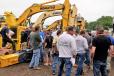 The crowd swarmed in to bid on the excavators. This Komatsu sold for $190,000. 