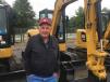 E.W Rust, owner of E Rust General Services in Delaware, checks out the Caterpillar mini-excavators 