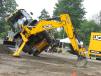 A JCB associate fearlessly shows off just how strong the JCB 4CX backhoe loader really is.