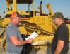 Looking over a Cat D6R XL dozer are Jason Sanders (L) and Trent Sanders of Sanders Hauling in Pineville, Ky. 
 
