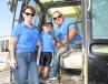 Candy Krantz (L) and Chris Krantz (R) of T&C Excavating Inc., Chapmansboro, Tenn., and their grandson, Carter Nicholson, are regular Ritchason attendees. They’re enjoying some family time while looking over machines of interest. 
 