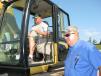 Glen Barrett (L) of Barrett’s Excavating, Christiana, Tenn., test operates a Cat 315CL excavator with Jim Marvel of A&B Contracting, Princeton, Ind.
 