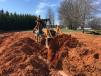 Hyder Construction uses its Case 580 Super M backhoe to finish up an installation of a septic tank in Gowensville, S.C.