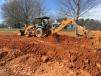 The Case 580 Super M backhoe is digging the lines for the septic tank for a homeowner on Hwy. 11 in Gowensville, S.C.