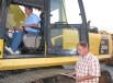 Michael (L) and Robert Armstrong, both of Armstrong Contractors, Columbia, S.C., inspect this Komatsu PC300LC excavator.
