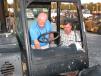Randy Tidwell (L) and Steve Carter of Mid Georgia Electrical Services, Macon, Ga., look over this Cat TL642C reach forklift.