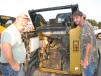 Joe (L) and Jason Wheat, Wheat Properties, Chattsworth, Ga., open up this Cat 299D compact track loader.