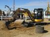 Gage Wattenhofer of Crow Wing Power, Brainerd, Minn., tries out a Caterpillar 304.5 mini-excavator at the show.
